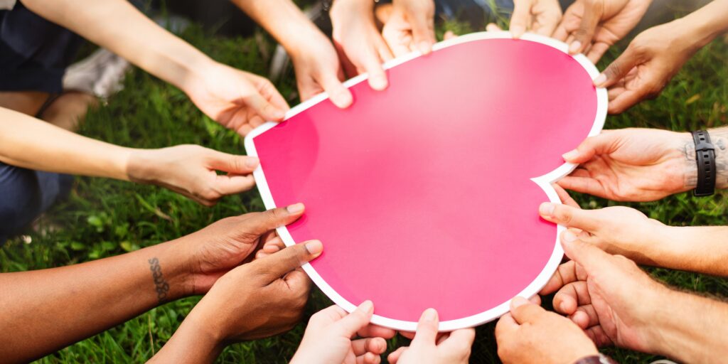 diverse,hands,holding,pink,heart.,many,diverse,hands,hold,heart